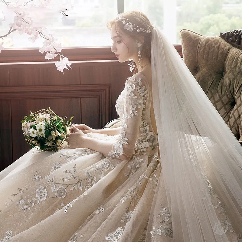 Long Sleeve Wedding Dress New Backless Luxury Hand Made Beading Pearls Lace Appliques Champagne Flash Princess Bridal Ball Gowns