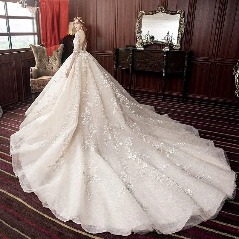 Long Sleeve Wedding Dress New Backless Luxury Hand Made Beading Pearls Lace Appliques Champagne Flash Princess Bridal Ball Gowns