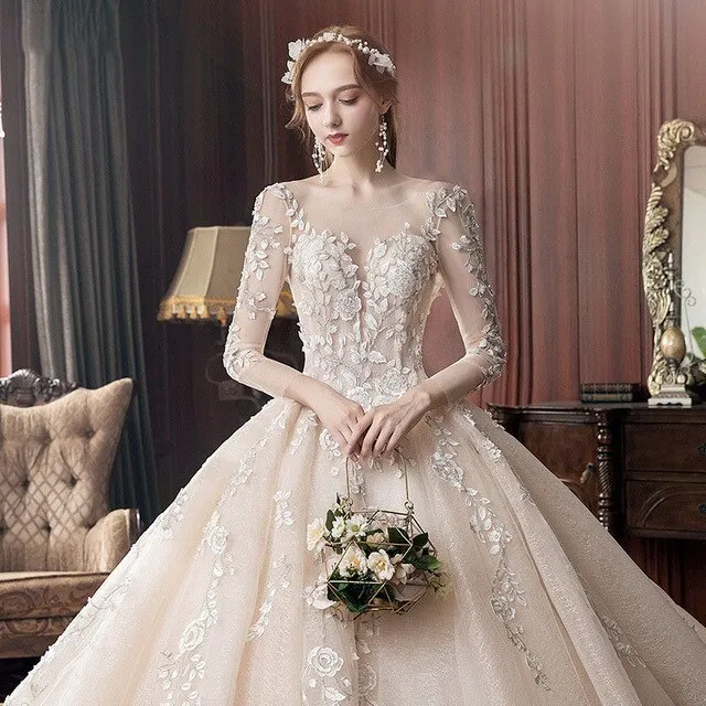 Long Sleeve Wedding Dress New Backless Luxury Hand Made Beading Pearls Lace Appliques Champagne Flash Princess Bridal Ball Gowns